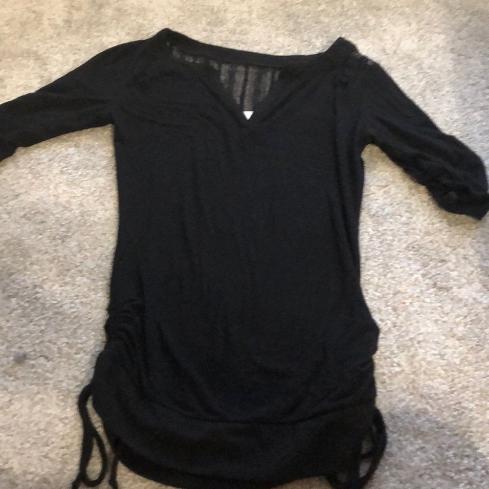 Black NWOT top with lace on the shoulders and back